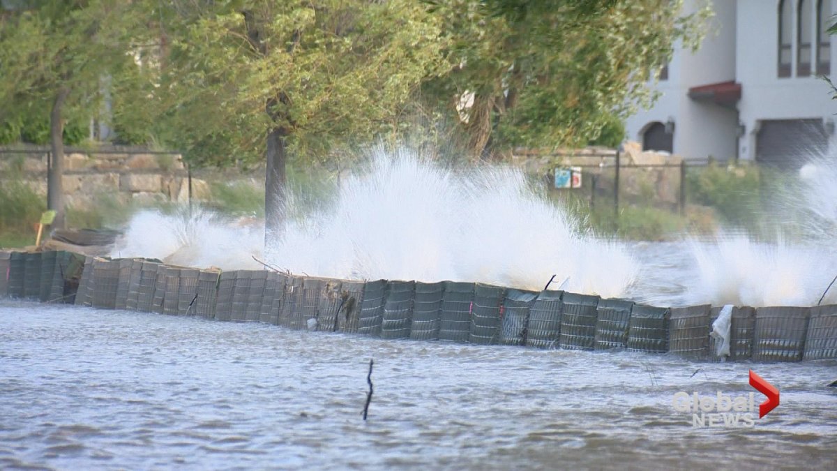 Damaging waves pummeled flood control barriers Tuesday night on Okanagan Lake. 