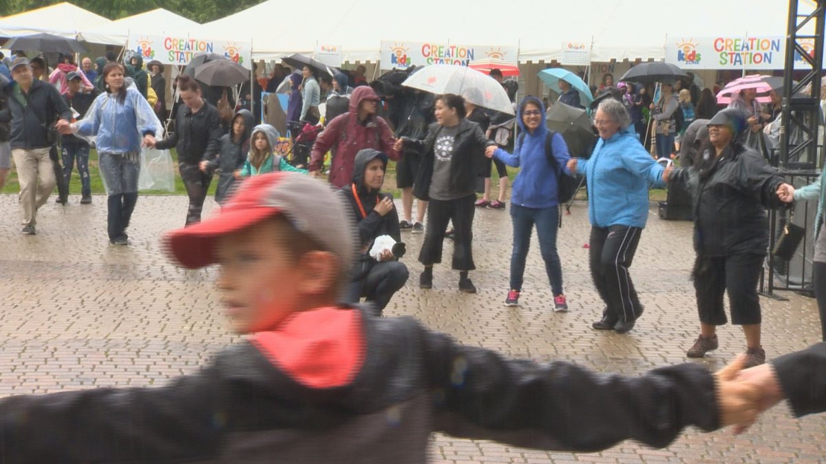 Hundreds joined hands in the rain for a nationwide round dance.