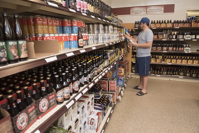 A man shops for beer.