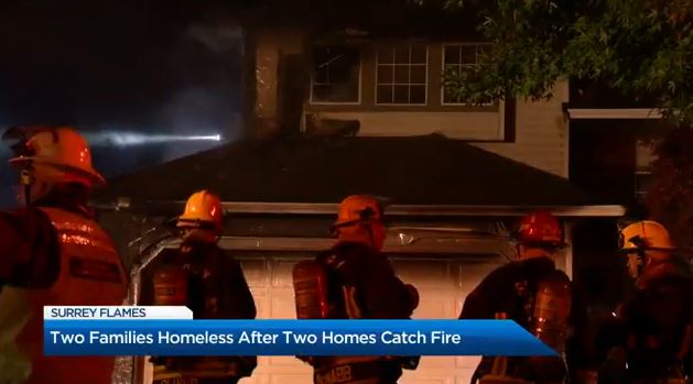 Firefighters outside a home in Surrey Thursday morning.