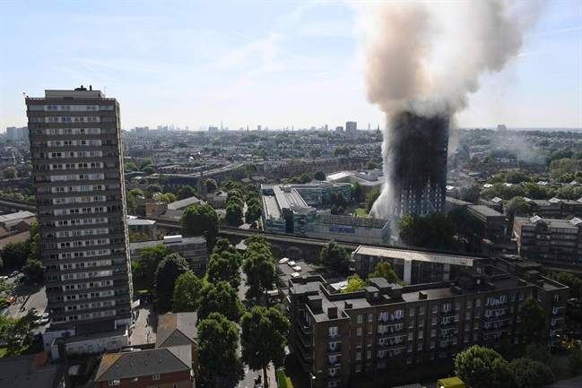 Smoke billows from a fire that engulfed the 24-storey Grenfell Tower in west London on June 14, 2017.