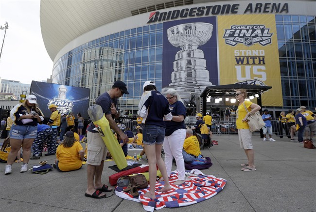Nashville Predators fans set up to watch outside Bridgestone Arena during the Stanley Cup Finals between the Nashville Predators and the Pittsburgh Penguins June 2017.