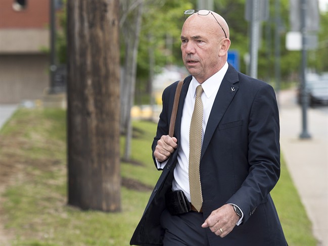 RCMP Commissioner Bob Paulson arrives to testify at the RCMP's trial on violating four charges of the Canada Labour Code in Moncton, N.B. on Thursday, June 15, 2017. 