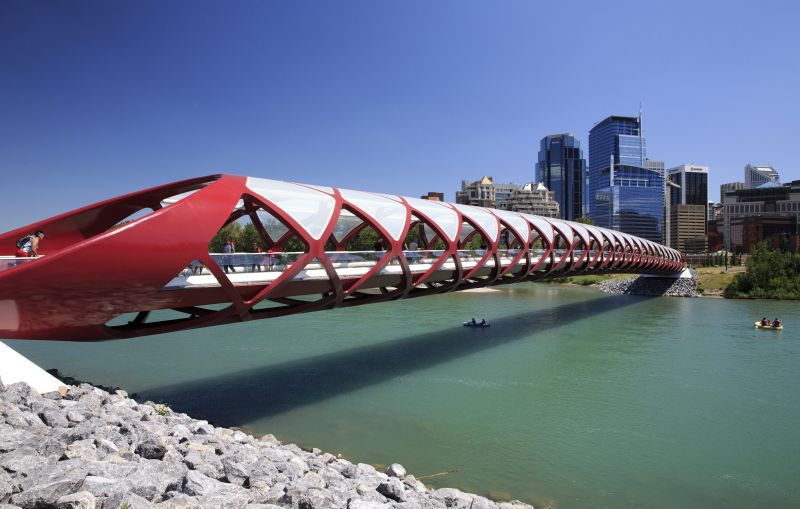 The Peace Bridge crosses the Bow River with downtown Calgary, Alberta visible behind on July 27, 2014.
