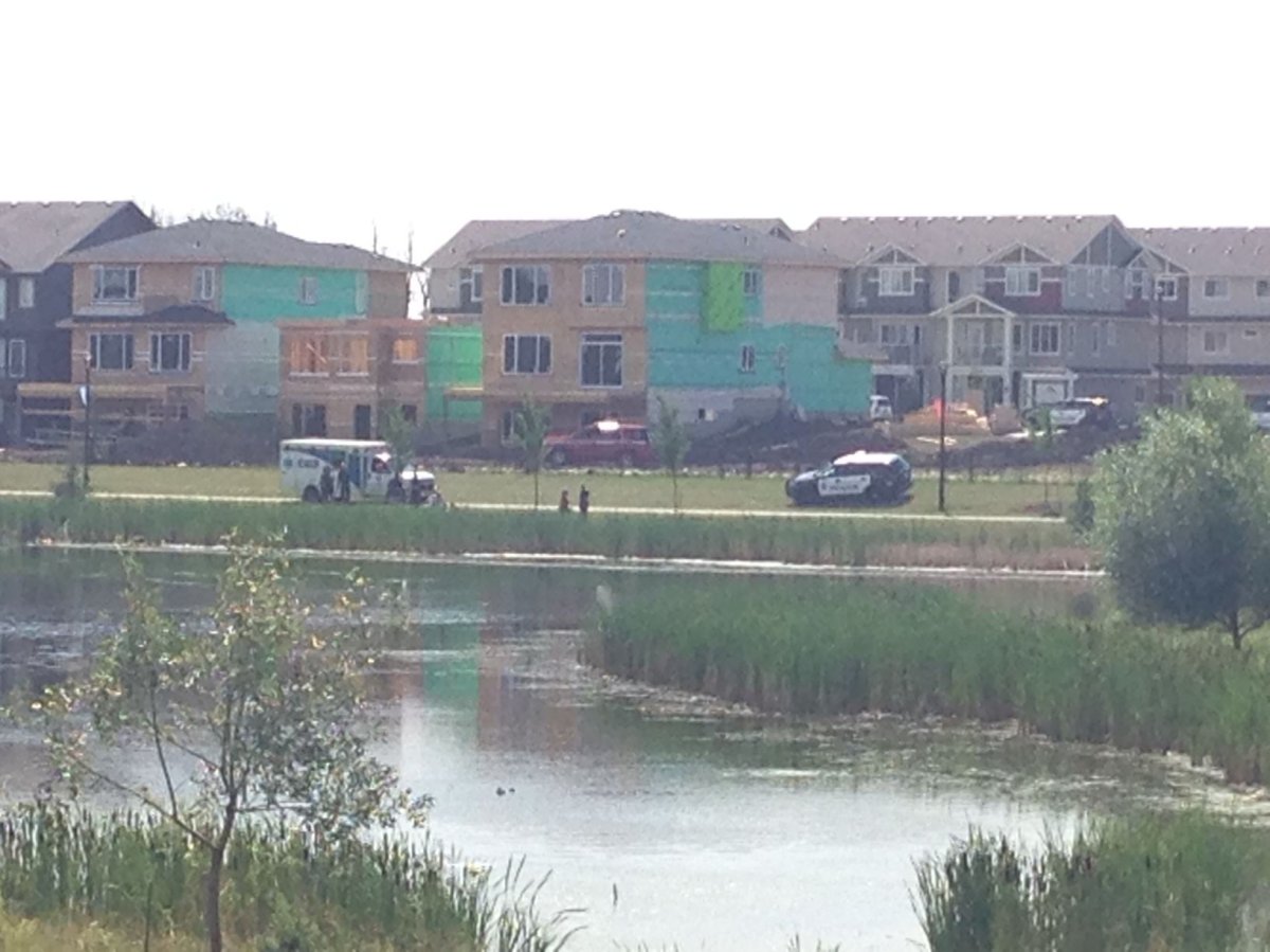 Emergency crews on scene at a pond in the north Edmonton neighbourhood of Crystallina Nera on Saturday, July 22, 2017.