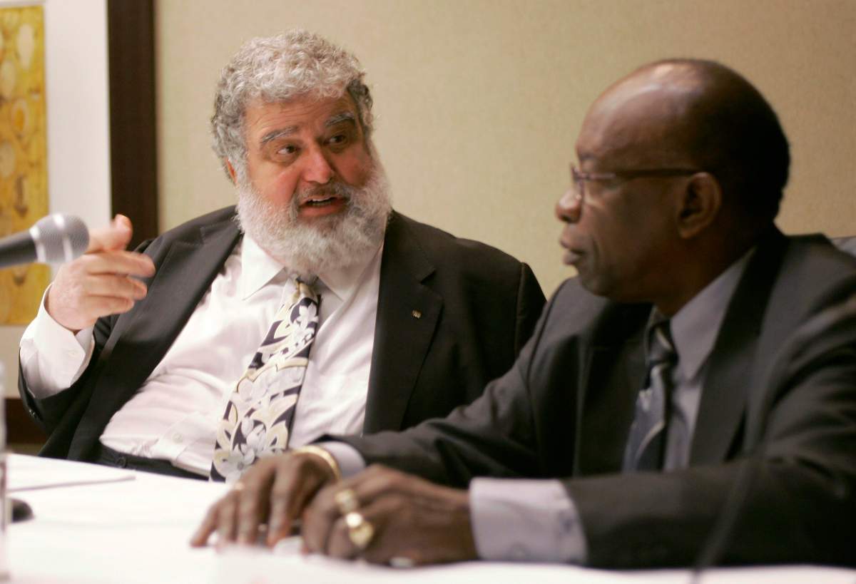 In this Jan. 28, 2008 photo, CONCACAF’s then-General Secretary Chuck Blazer, left, and then-President Jack Warner chat during a news conference in Miami. over title of his FIFA pension to satisfy payments owed to the U.S. government.