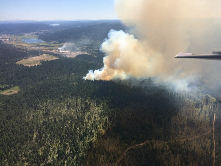 Air and ground crews battle a forest fire west of 100 Mile House on July 6, 2017.