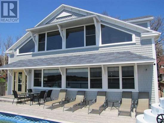This spacious waterfront property features a large barn that can be converted to a guest house