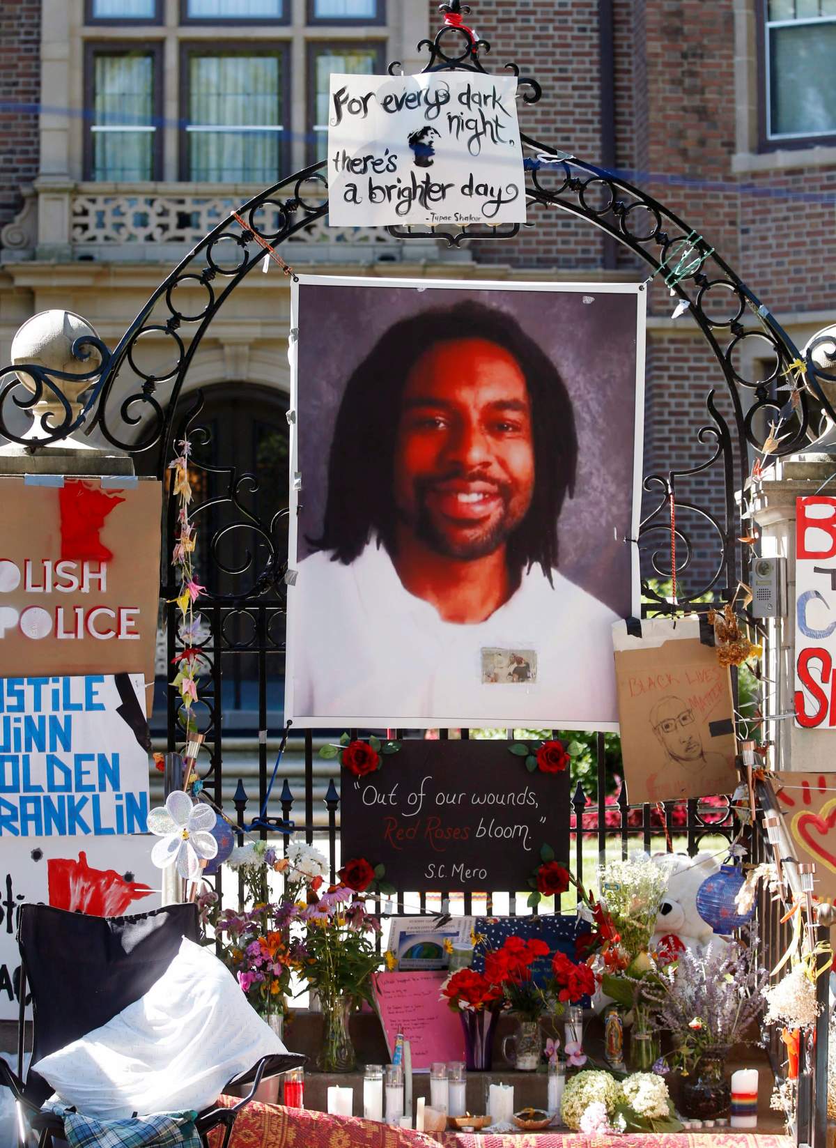 In this July 25, 2016, file photo, a memorial including a photo of Philando Castile adorns the gate to the governor's residence where protesters demonstrated in St. Paul, Minn., against the July 6 shooting death of Castile by St. Anthony police Officer Jeronimo Yanez during a traffic stop in Falcon Heights, Minn. 
