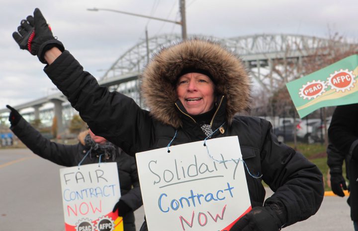 Workers of the Blue Water Bridge picket strike at the bridge administration building, next to the span between Sarnia and Port Huron, Michigan on Nov. 21, 2016, in Sarnia, Ont.