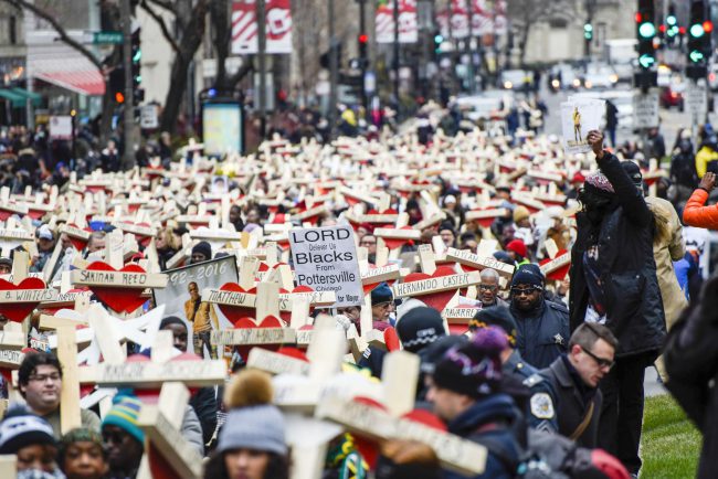 A Peace March takes place down Chicago's Magnificent Mile, Michigan Avenue, to honour the survivors and victims of the city's escalating gun violence, Dec. 31, 2016.