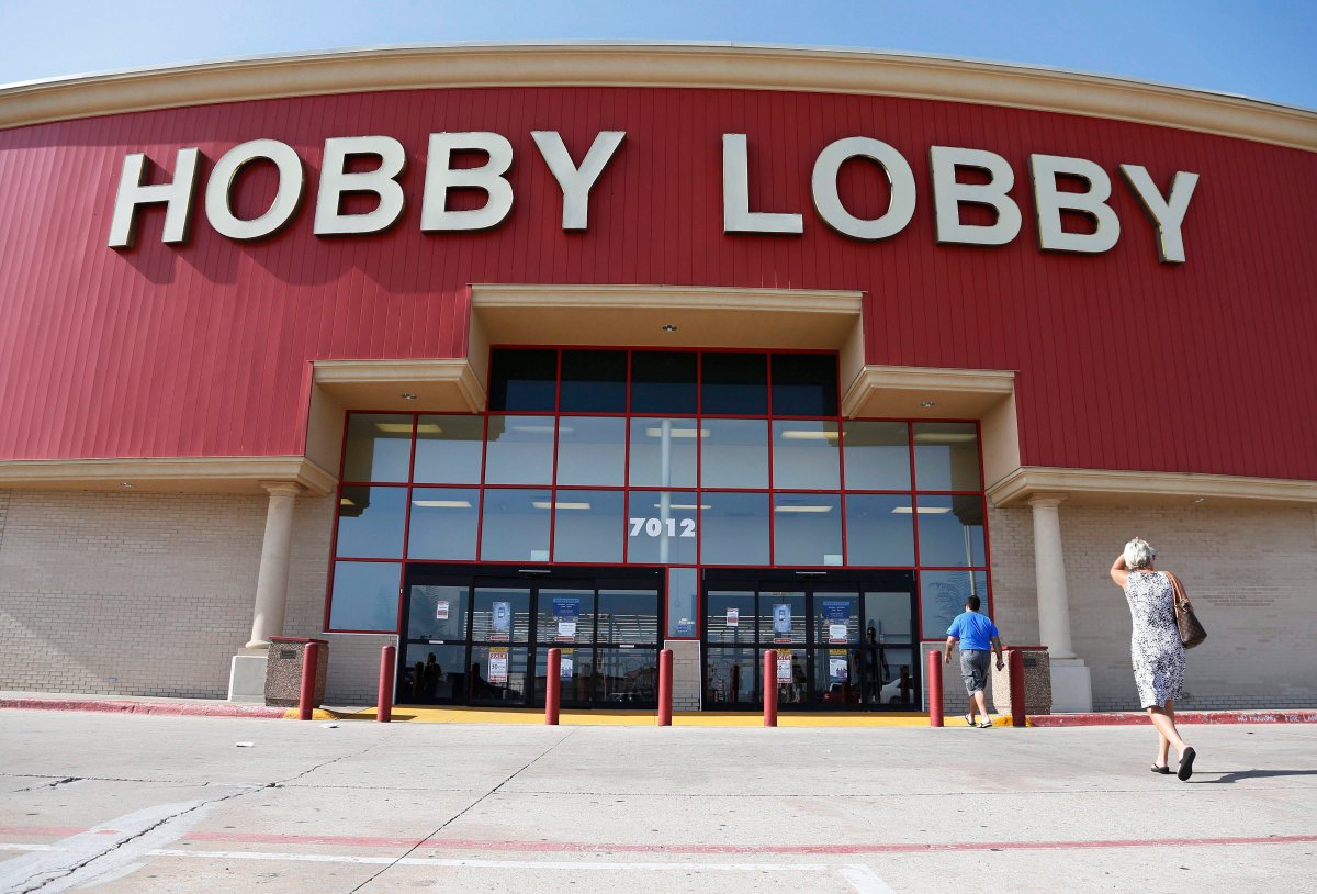  In this Monday, June 30, 2014, file photo, customers walk to a Hobby Lobby store in Oklahoma City.