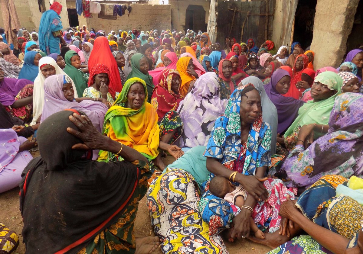 Women mourn following a suicide bomb attack in a village near Maiduguri, Nigeria on June 19, 2017.  