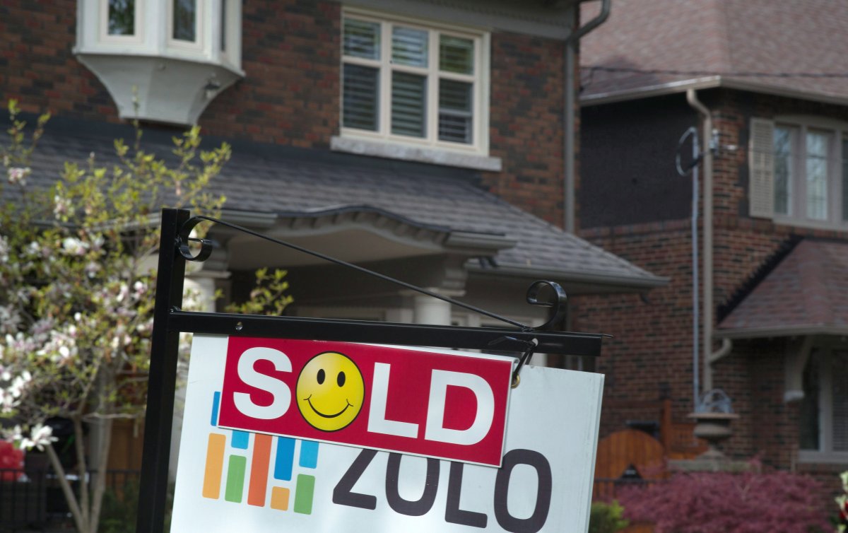 A sold sign is shown in front of west-end Toronto homes, Sunday, May 14, 2017.