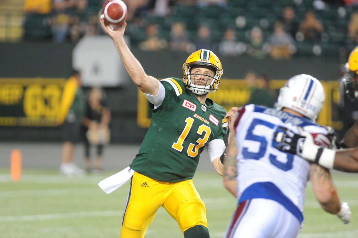 Edmonton Eskimos player #13 (QB) Mike Reilly tries to throw a pass during the 4th quarter of CFL game action between the Edmonton Eskimo's and the Montreal Alouettes at the Brick Field located atCommonwealth stadium in Edmonton Friday, June 30 /2017. Eskimos won the game 23-19. 