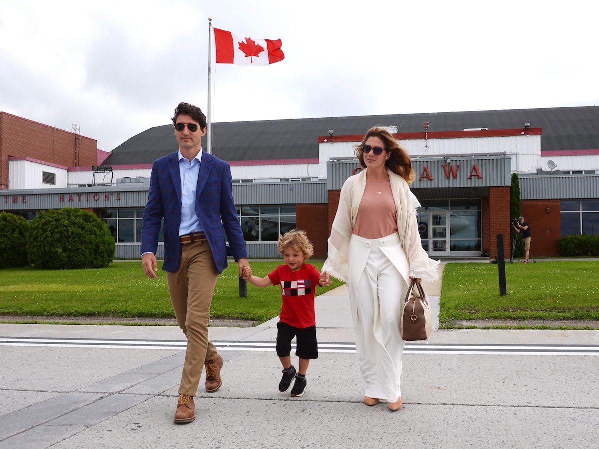 Prime Minister Justin Trudeau along with his son Hadrien and wife Sophie Gregoire Trudeau board a plane for Dublin, Ireland in Ottawa, Ont. on Monday, July 3, 2017. THE CANADIAN PRESS/Ryan Remiorz