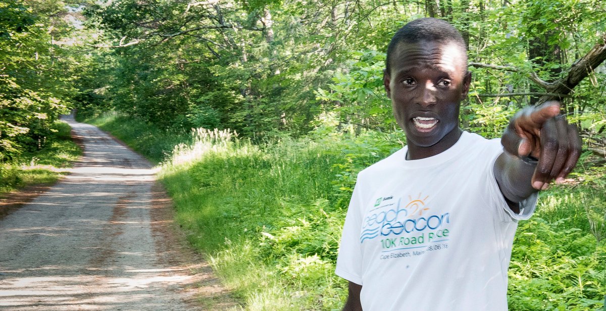 In this July 5, 2017, photo, Moninda Marube points to the house on Whitman Spring Trail in Auburn, Maine, while recounting his encounter with a pair of bears that chased him. Marube, a professional runner from Kenya, said he had to outrun the two charging bears while training in the woods on Wednesday. 