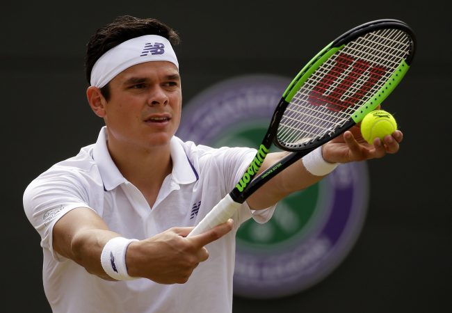 Canada's Milos Raonic prepares to serve to Spain's Albert Ramos-Vinolas during their Men's singles match on day six at the Wimbledon Tennis Championships in London, July 8, 2017.