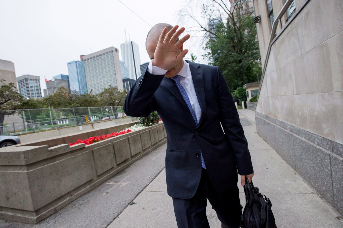 Sears Canada Chief Financial Officer Billy Wong walks away from the Ontario Superior Court in Toronto on Thursday, July 13, 2017. 