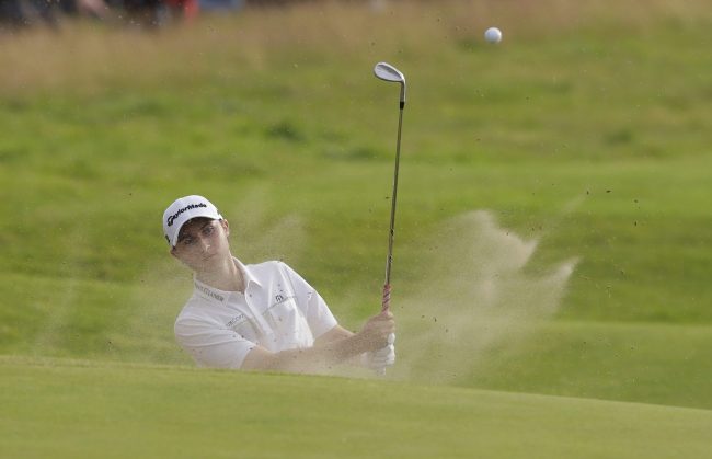 Canada's Austin Connelly plays out of a bunker on the 17th hole during the third round of the British Open Golf Championship, at Royal Birkdale, Southport, England, July 22, 2017.