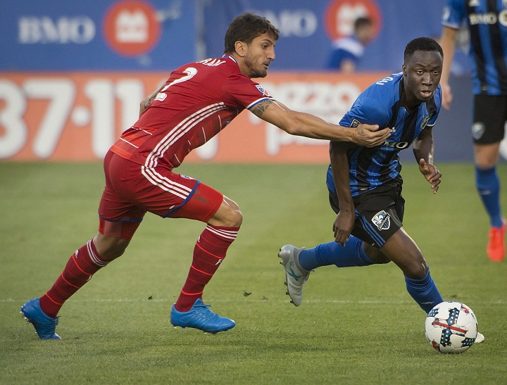 Montreal Impact's Ballou Tabla is chased by FC Dallas' Hernan Grana during first half MLS action in Montreal on Saturday, July 22, 2017.