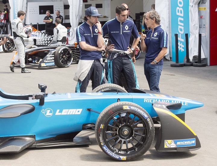 Renault drivers Nicolas Prost, left, of France, and Sebastien Buemi, centre, of Switzerland, speak with team manager Alain Prost at the Montreal Formula ePrix electric car race, in Montreal on Friday, July 28, 2017. Buemi's Renault electric car, which needed major work after a crash during pre-race practice, was found to be four kilograms under the 880-kilogram minimum weight, leading to his disqualification. Sunday, July 30, 2017.