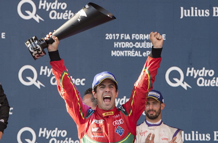 Lucas Di Grassi of Brazil celebrates after being presented with the driver's championship trophy at the Montreal Formula ePrix electric car race Sunday, July 30, 2017 in Montreal. THE CANADIAN PRESS/Paul Chiasson