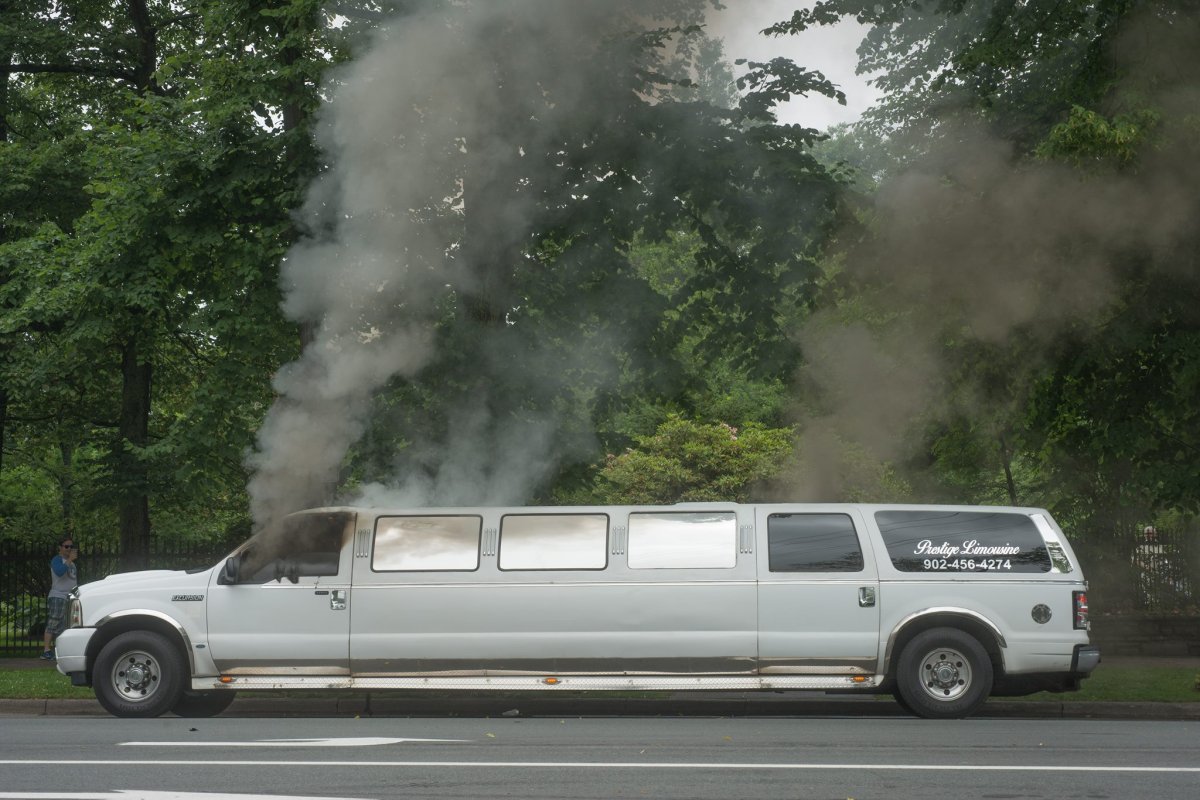 Smoke pours from the windows of a limousine belonging to Prestige Limousines. The vehicle caught fire on Saturday, July 8, 2017. 