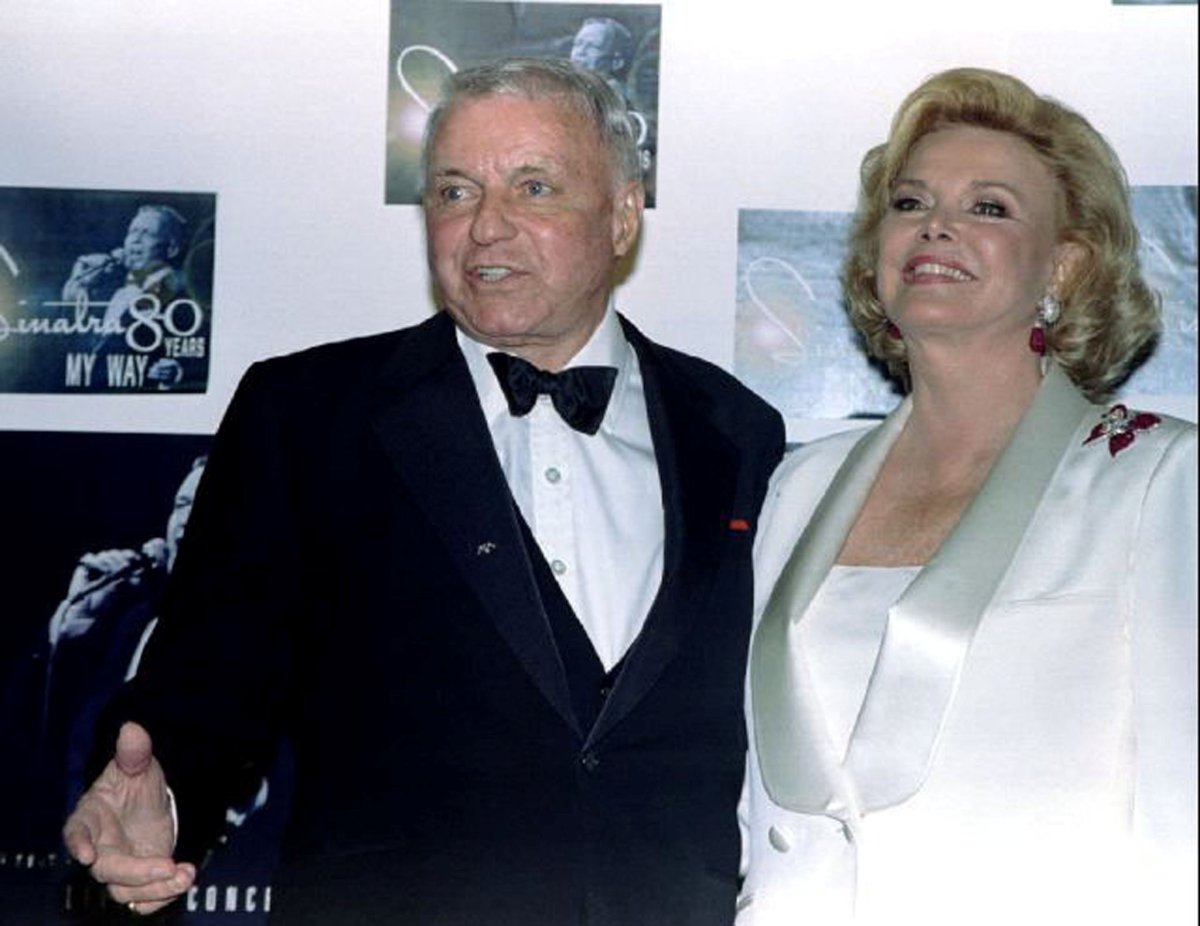 Legendary entertainer Frank Sinatra and his wife Barbara pose for photographers backstage at the taping of an ABC TV special "Sinatra: 80 Years My Way" at the Shrine Auditorium in Los Angeles, California, U.S. on November 19, 1995. 