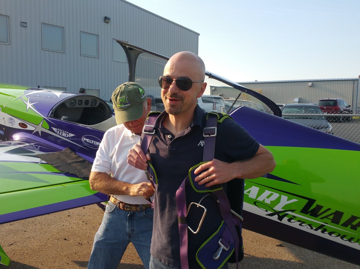 Rob Breakenridge gets outfitted in a parachute before taking to the skies in a MX2 monoplane on July 28, 2017.