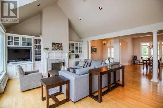This home features a landscaped grounds, a large deck featuring a view with ocean vistas