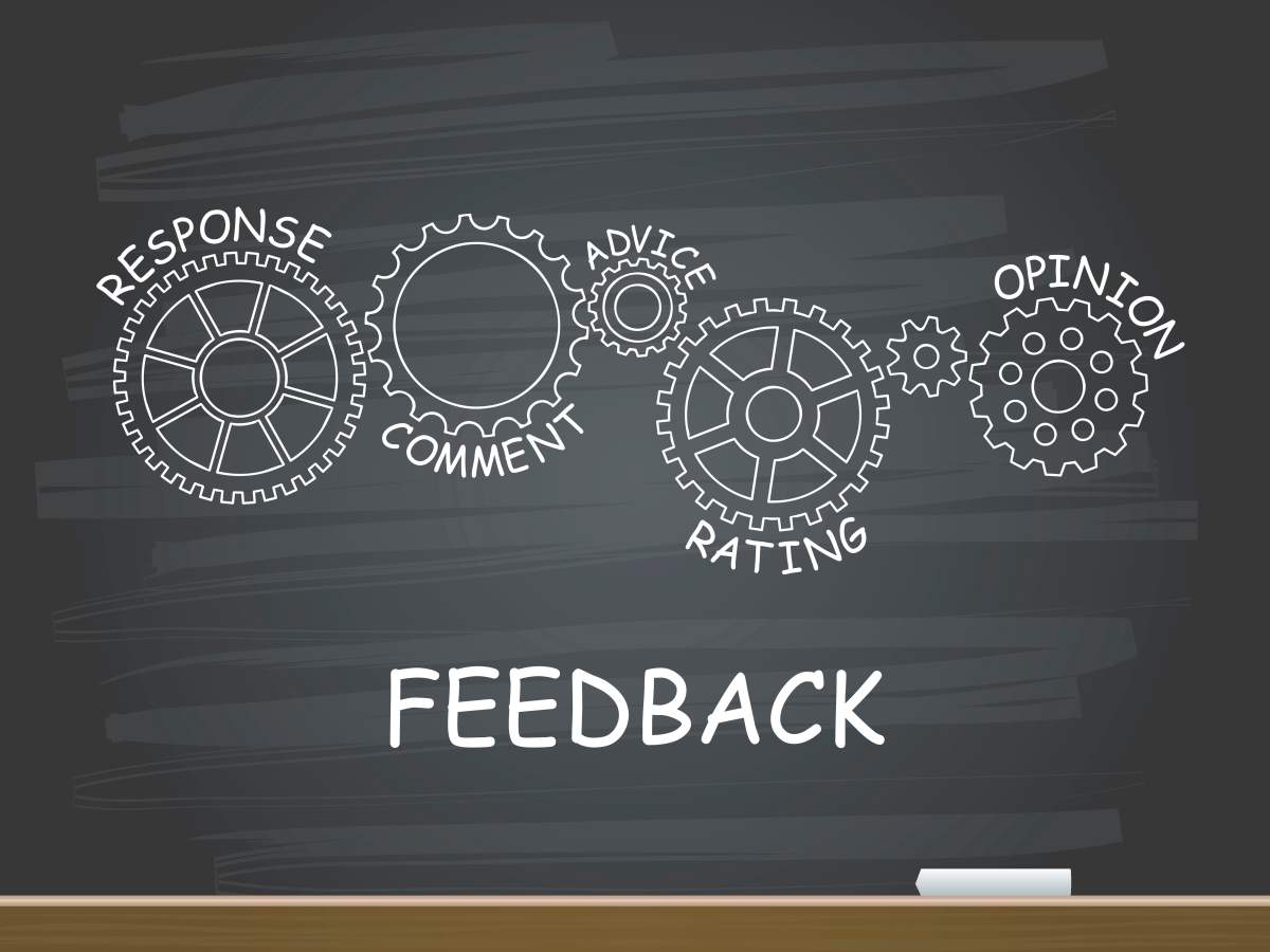 Feedback with gear concept on chalkboard. Vector illustration.