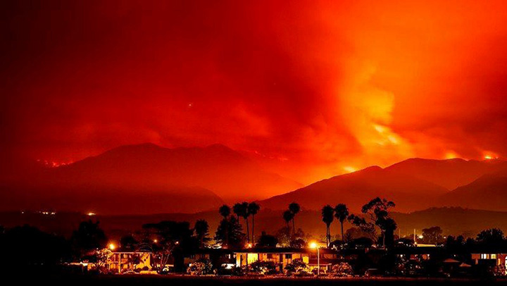 Smoke is illuminated by the Whittier wildfire near Santa Ynez, California on July 8, 2017.