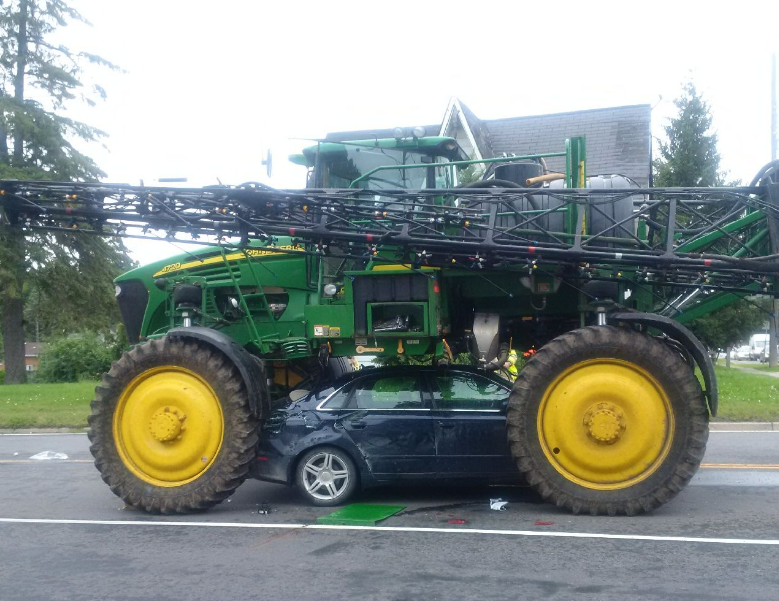OPP shared a photo of an Audi pinned beneath a large agricultural tractor in Port Perry on Thursday.