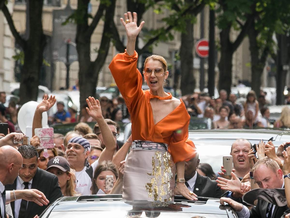 Pictured here among adoring fans in Paris, Celine Dion is as beloved for her timeless hits as she is revered for her extraordinary style. 