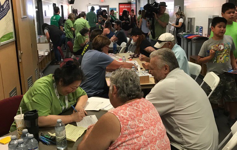 Evacuees register at the Cloverdale Arena.
