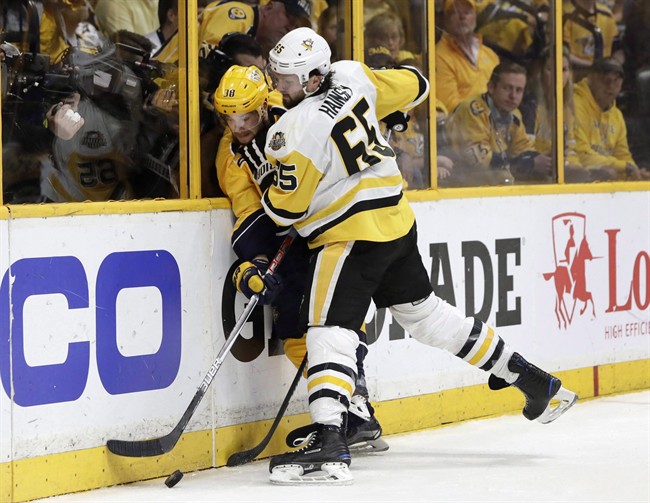 Pittsburgh's Ron Hainsey (65) checks Nashville's Viktor Arvidsson in Game 6 of the Stanley Cup Final, June 11, 2017. Toronto signed veteran D-man Hainsey to a US$6-million, two-year contract on Saturday.