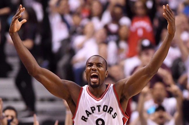 Toronto Raptors forward Serge Ibaka (9) celebartes after making a three-pointer against the Cleveland Cavaliers during second half NBA playoff basketball action in Toronto on Sunday, May 7, 2017. 
