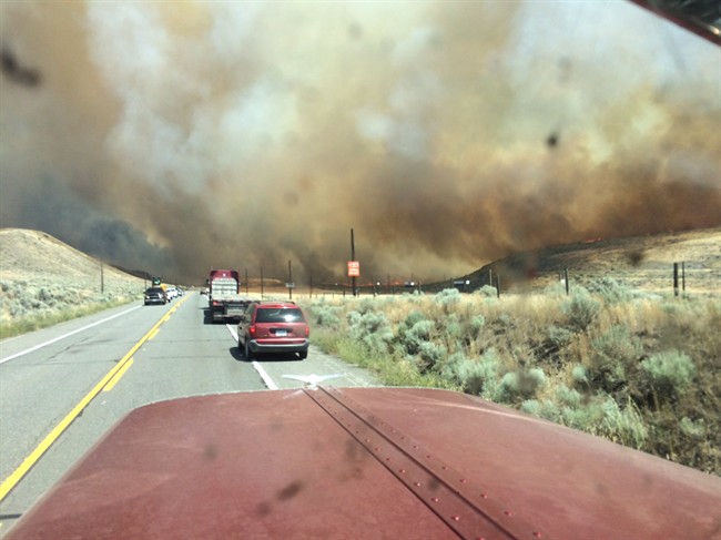 Smoke fills the sky as a wildfire burns in Ashcroft, B.C., on Friday, July 7, 2017.