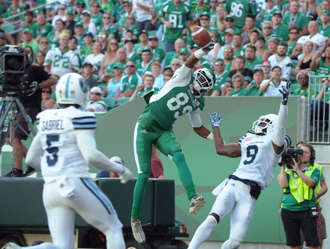 Saskatchewan Roughriders wide receiver Duron Carter (89) makes a one-handed grab for a touchdown in front of Toronto Argonauts defensive back Akwasi Owusu-Ansah (9) during first half CFL football action in Regina on Saturday, July 29, 2017. It was a good, bad and ugly type week in the CFL. Carter's one-handed grab in Saskatchewan's 38-27 win over Toronto would qualify as good with Argonauts defender Johnny Sears' stunning decision not to touch receiver Bakari Grant while he was on the ground being the bad. 