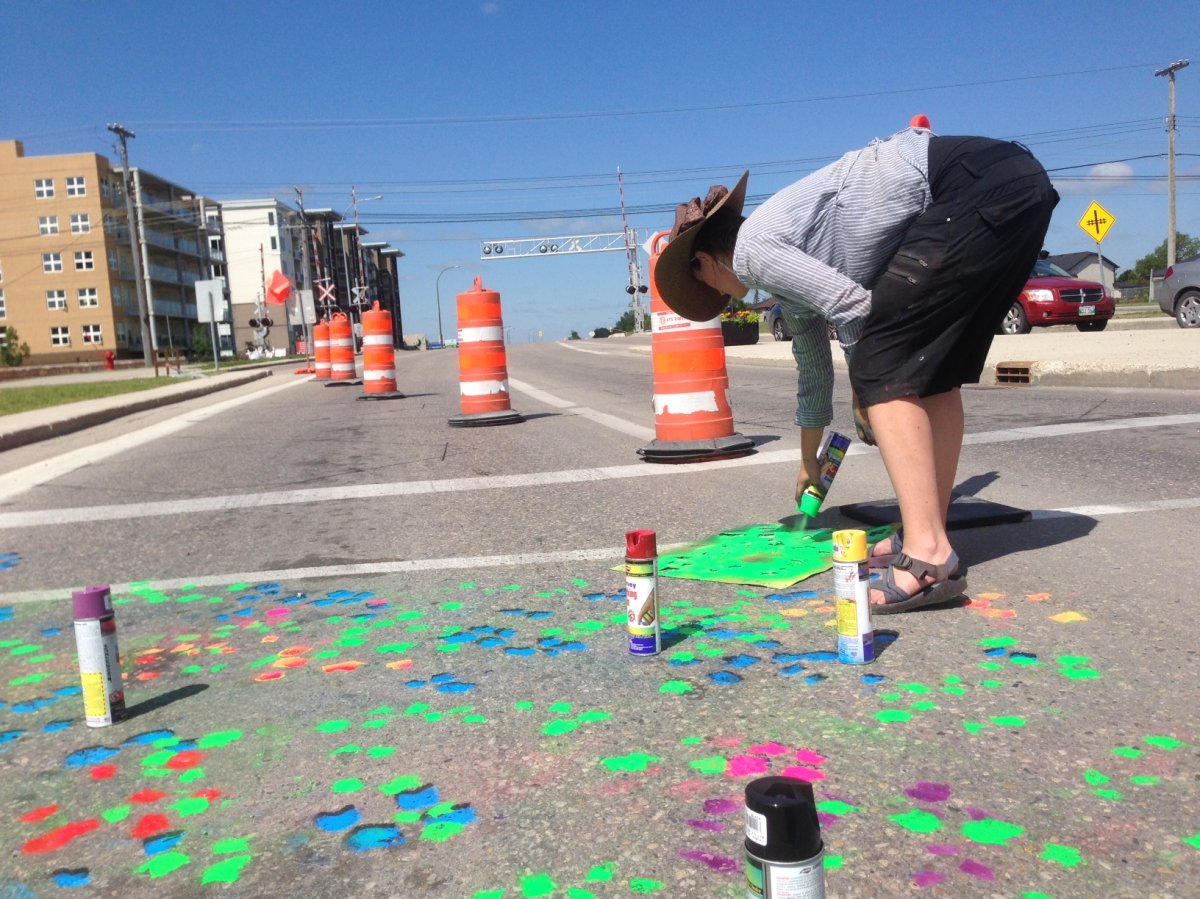 Artists are painting crosswalks in St. Norbert and St. Boniface.