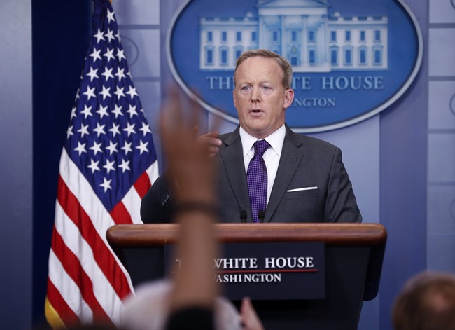 White House press secretary Sean Spicer points to members of the media as he answers questions in the Brady Briefing room of the White House in Washington, Monday, July 17, 2017. 