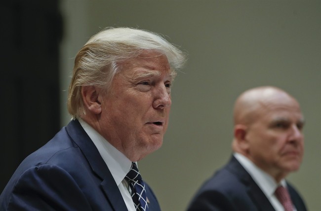 President Donald Trump, with National Security Adviser H.R. McMaster, right, speaks while having lunch with services members in the Roosevelt Room of the White House in Washington, July 18, 2017.