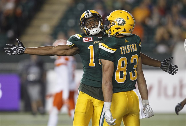 Edmonton Eskimos wide receiver Vidal Hazelton (15) and wide receiver Brandon Zylstra (83) celebrate the two point conversion against the B.C. Lions during second half CFL action in Edmonton, Alta., on Friday July 28, 2017. 