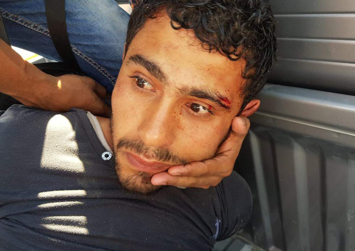 Passerby and members of hotel security detain the alleged assailant who stabbed several holidaymakers in Hurghada, Egypt.