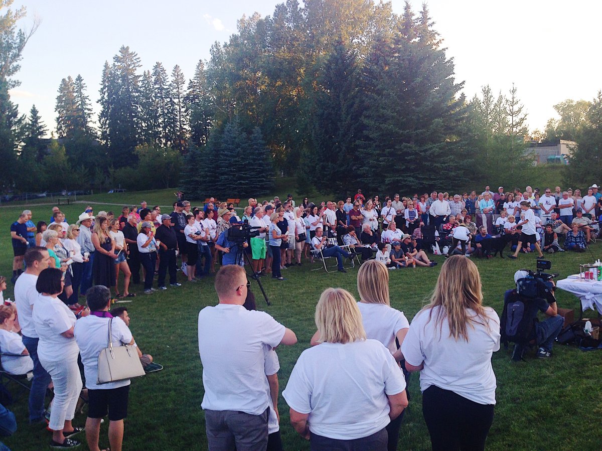 Family, friends and strangers gather for vigil in Marda Loop.