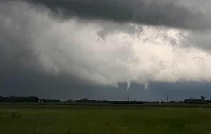 A funnel cloud is shown just east of the Perimeter Highway Saturday afternoon.