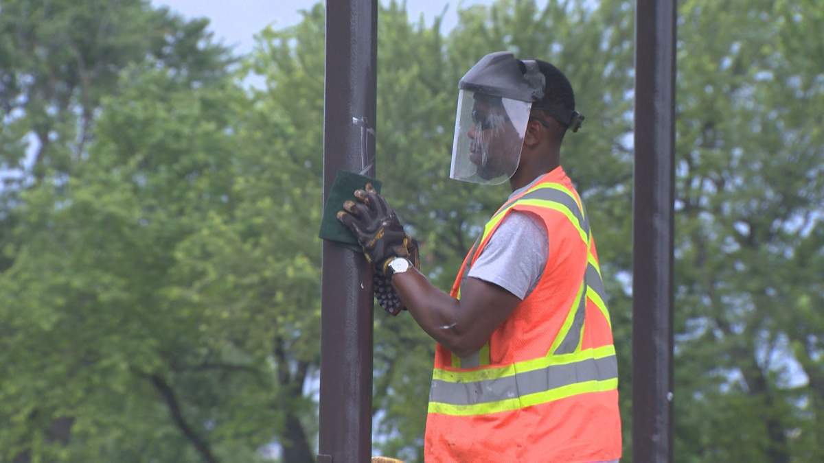 Montreal city workers cleaning up the Mordecai Richler Gazebo. Thursday July 20, 2017.