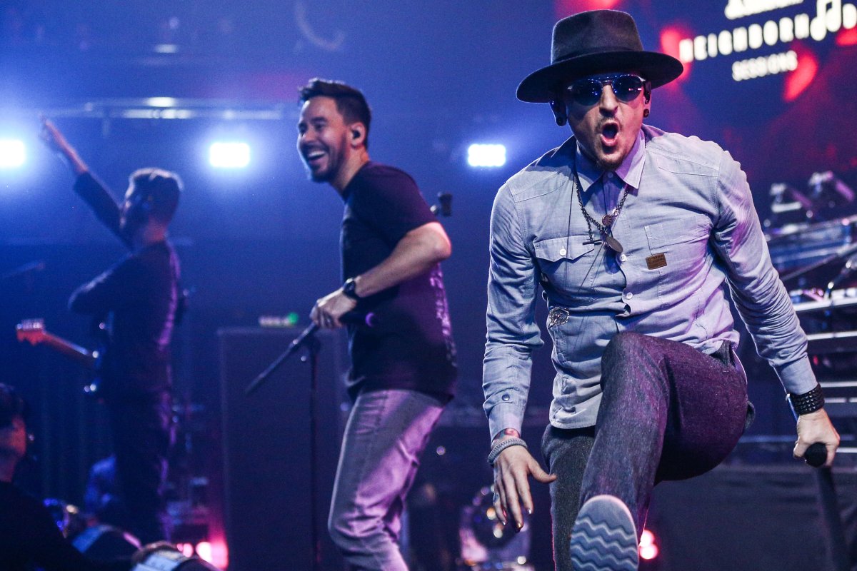 (L-R) Brad Delson, Mike Shinoda and Chester Bennington of Linkin Park perform on stage at the iHeartRadio Album Release Party in Los Angeles on May 22, 2017 in Burbank, California.  