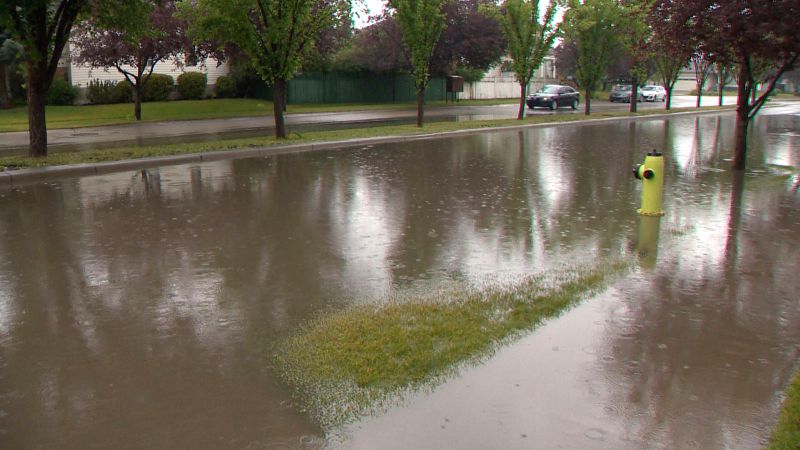 Flooding on Hidden Valley Drive N.W. on Tuesday, July 11, 2017.